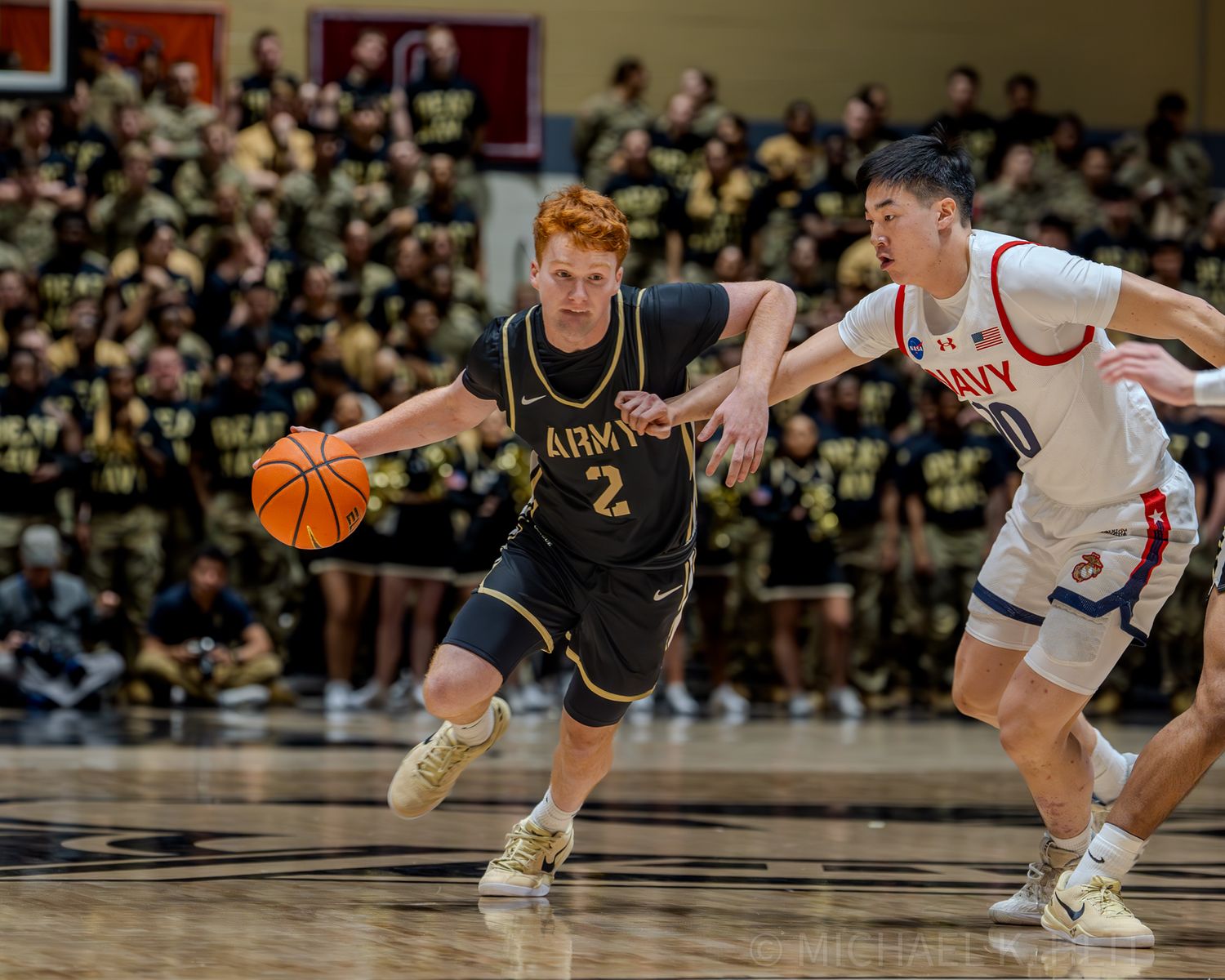 Army and Navy players battle for position during intense basketball action.