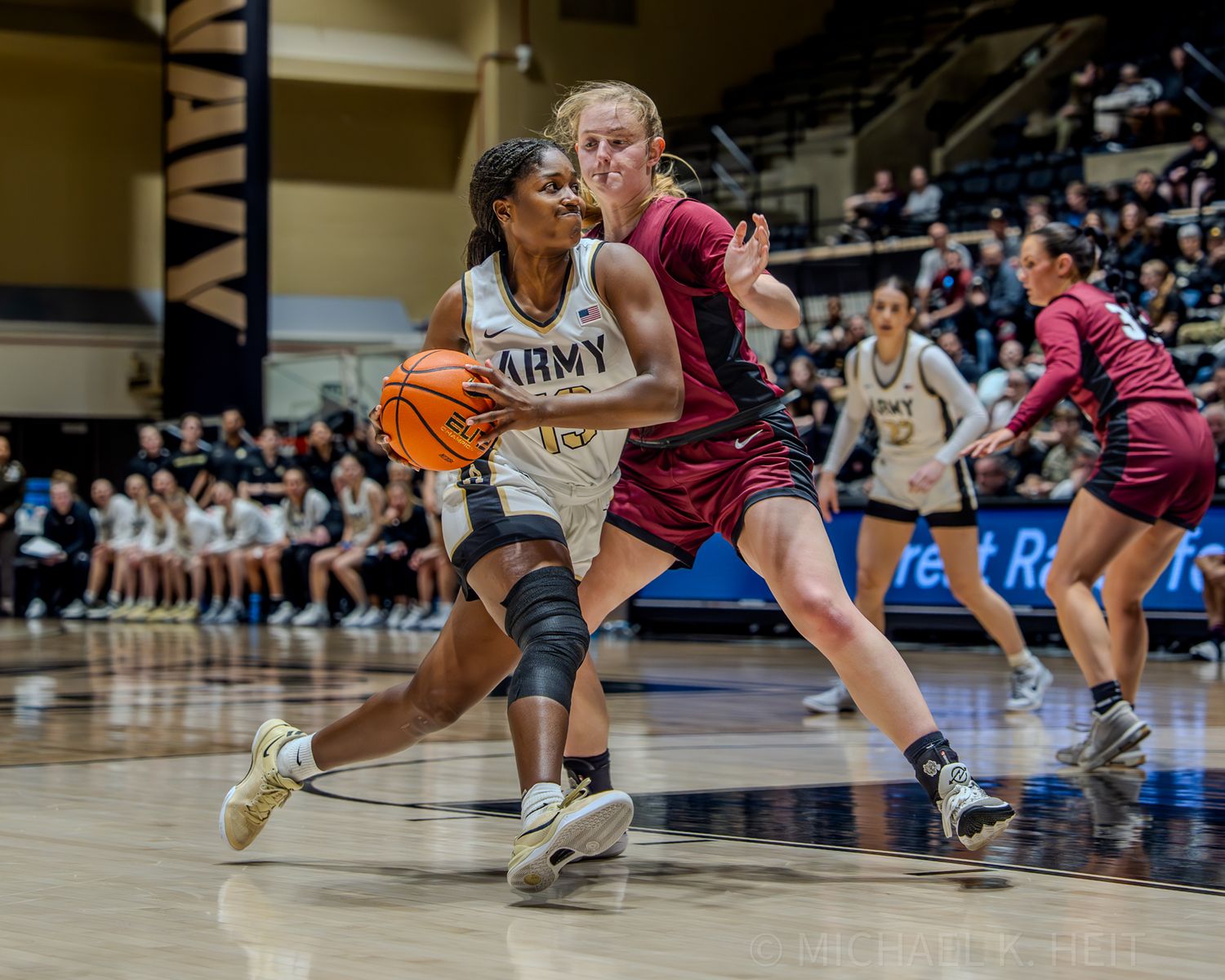Basketball players scramble for position during an intense moment of gameplay on the court.