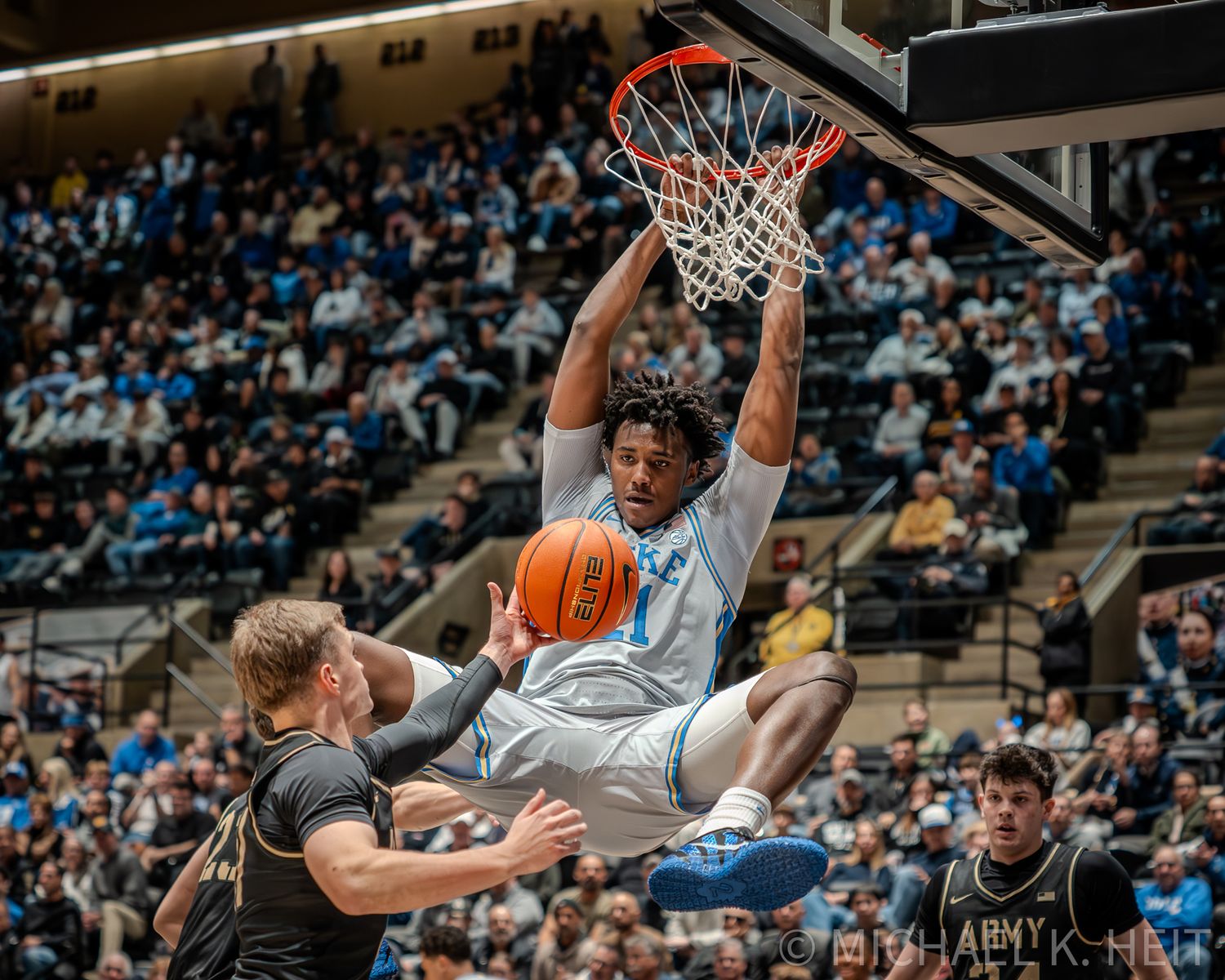 Duke basketball player Patrick Ngongba II dunking at West Point