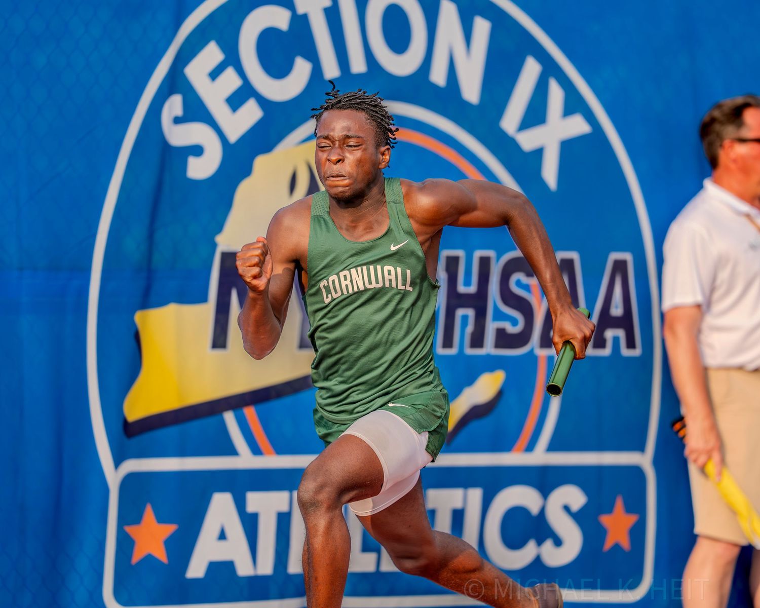 Athletes compete in track events at a Section IX athletics meet.