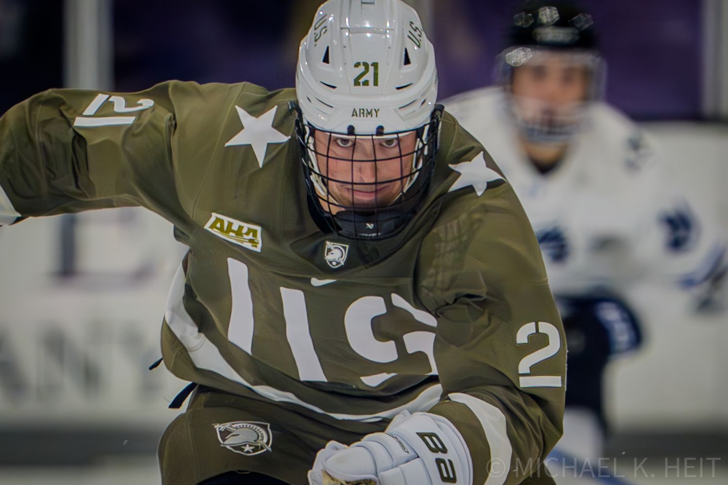 Hockey players in military-style camouflage uniforms battle for the puck on ice.
