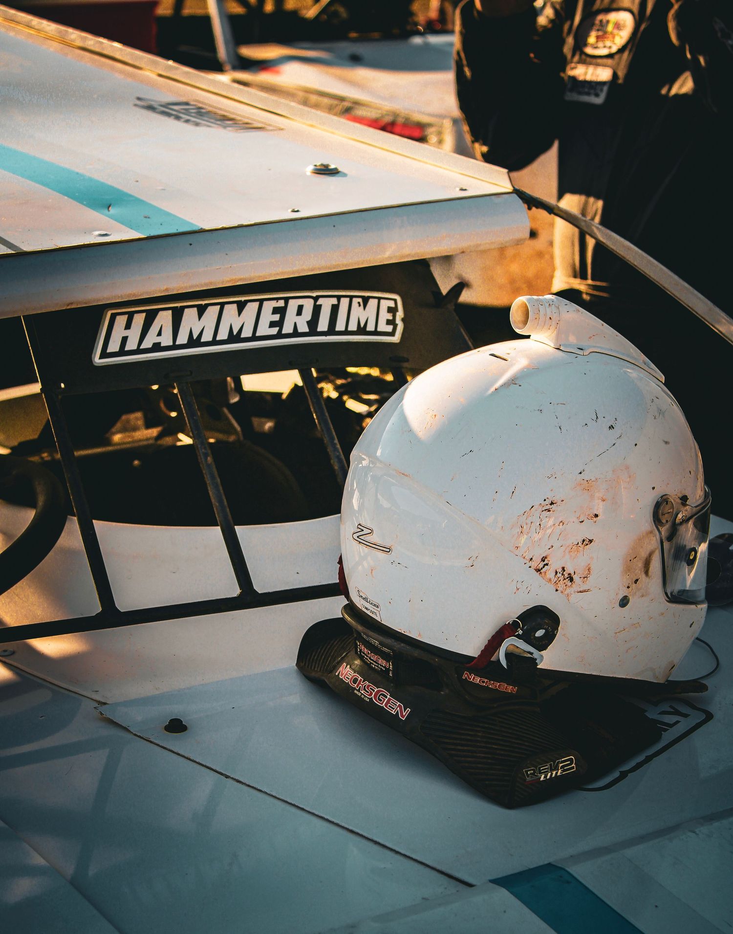 Close-up shots of a white racing helmet with Hammertime branding in various angles.