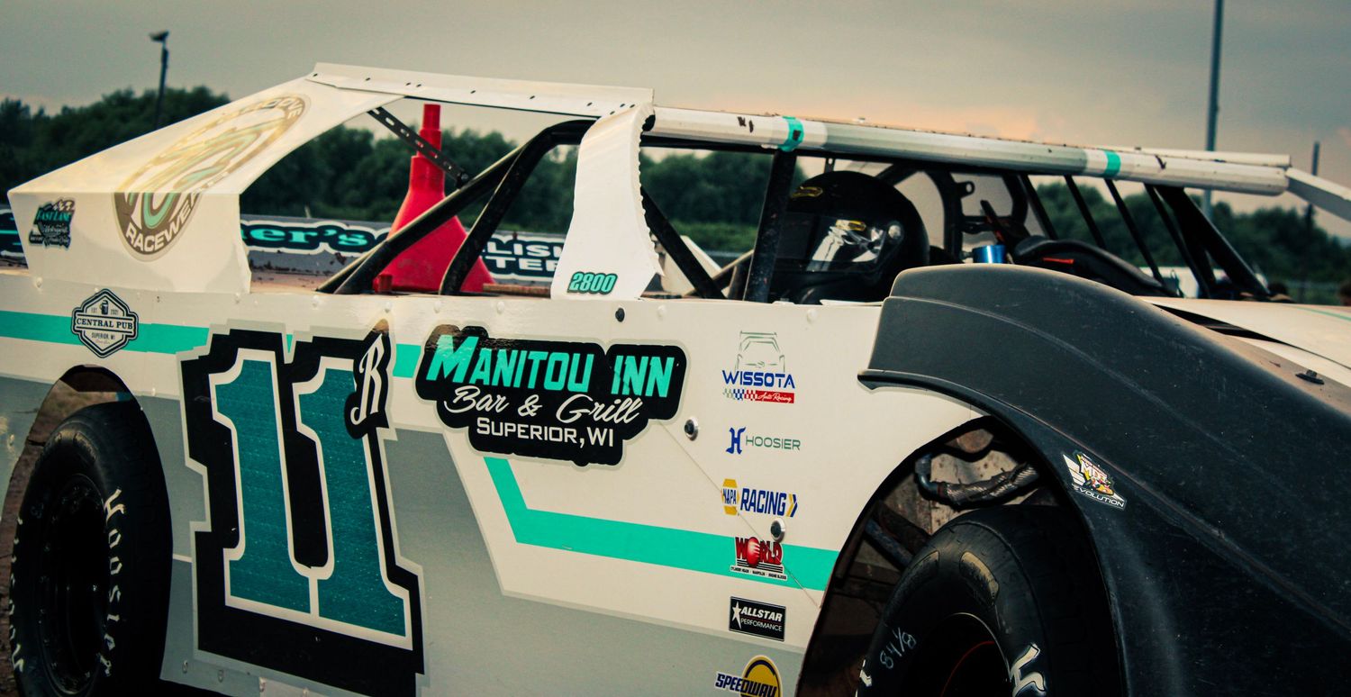 Anderson Motorsports car sitting at a racetrack.