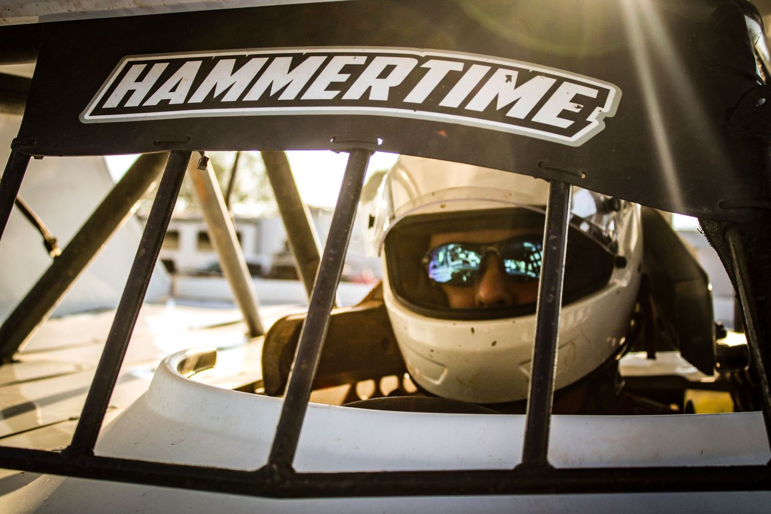 Interior shots of a race car showing Hammertime decals and dashboard details.