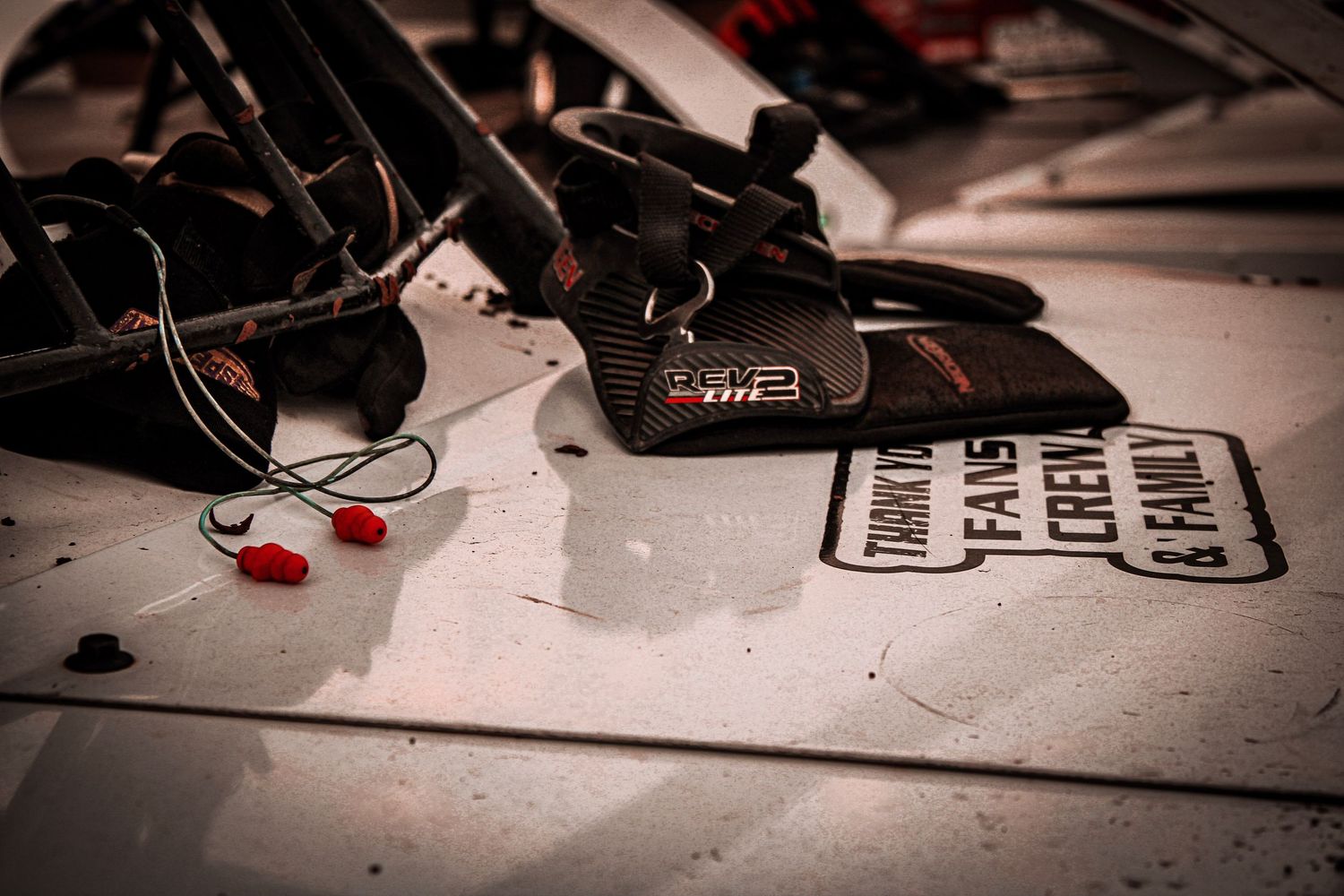 A collection of dark and moody photographs arranged in a filmstrip-style layout showing various objects and textures.