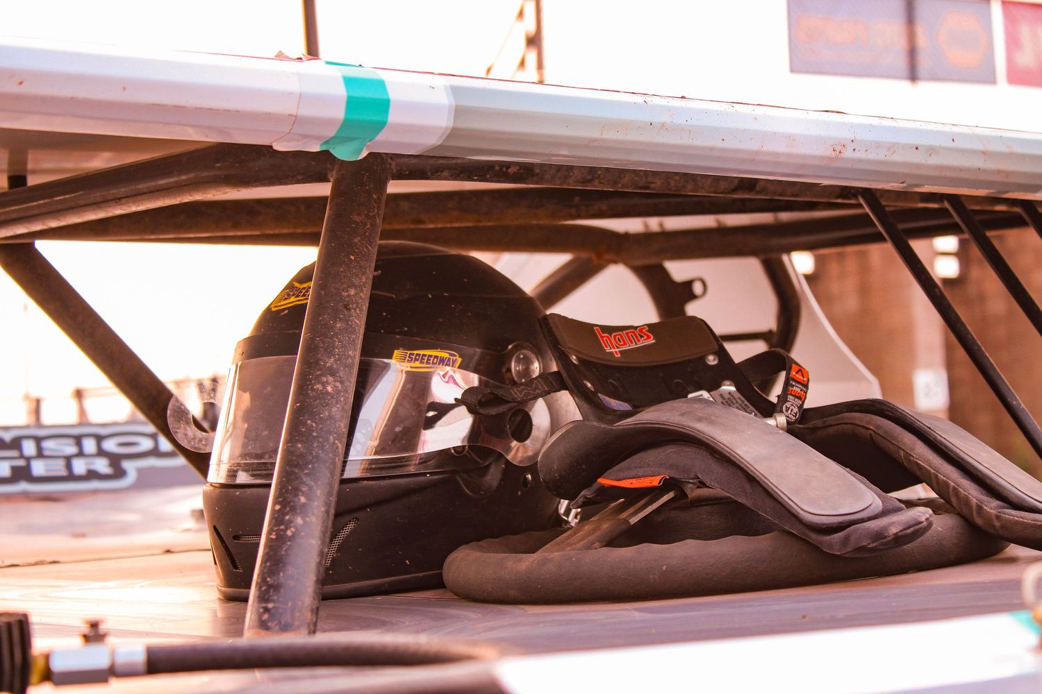 Close-up view of race car interior showing driver's seat and controls.