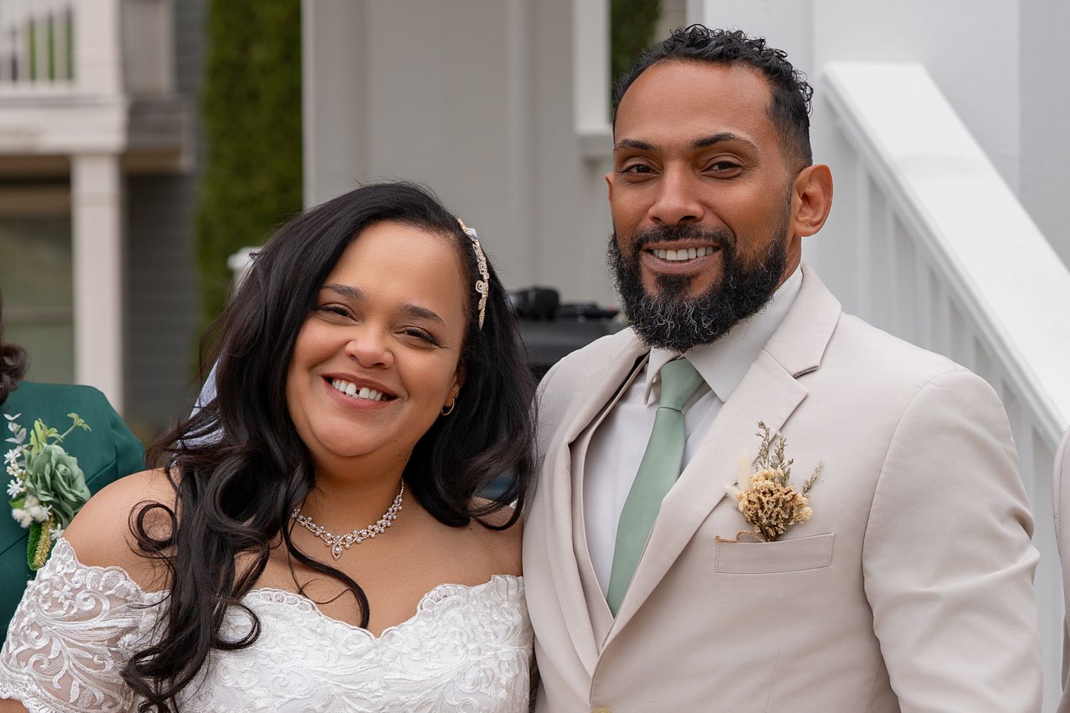 A wedding celebration with people in formal white and black attire posing together in a series of photos.
