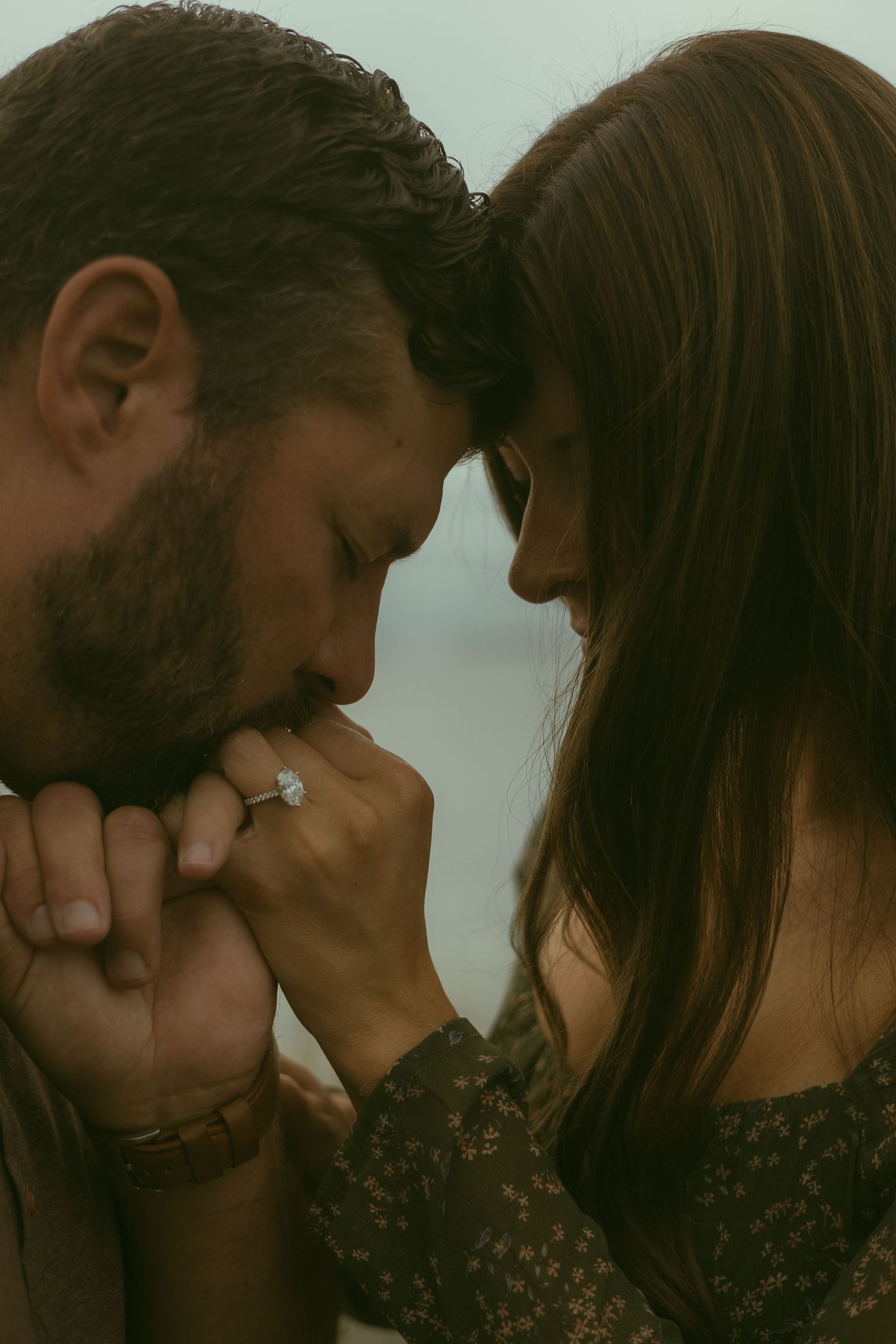 An intimate close-up of a couple sharing a tender moment.