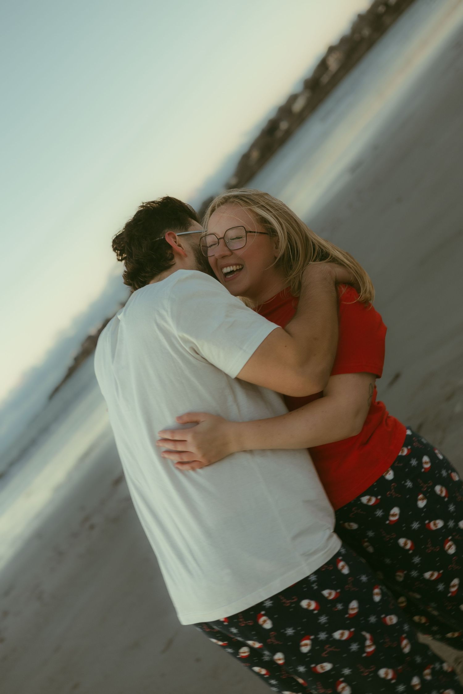 Intimate embrace captured in a series of candid moments against a light background.