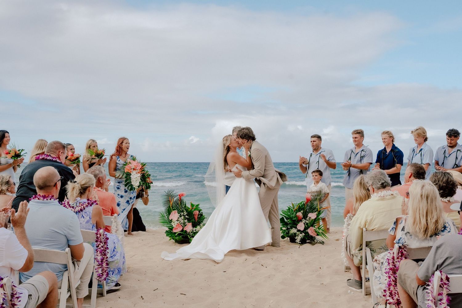 A series of beach wedding ceremony photos showing guests and celebrations along a scenic oceanfront setting.