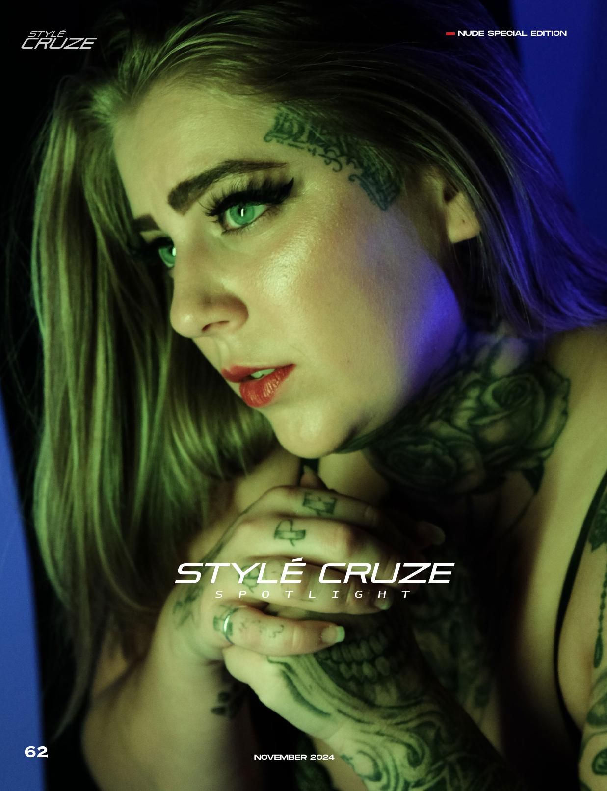 Artistic portrait with green and blue lighting showcasing elaborate tattoo art.
