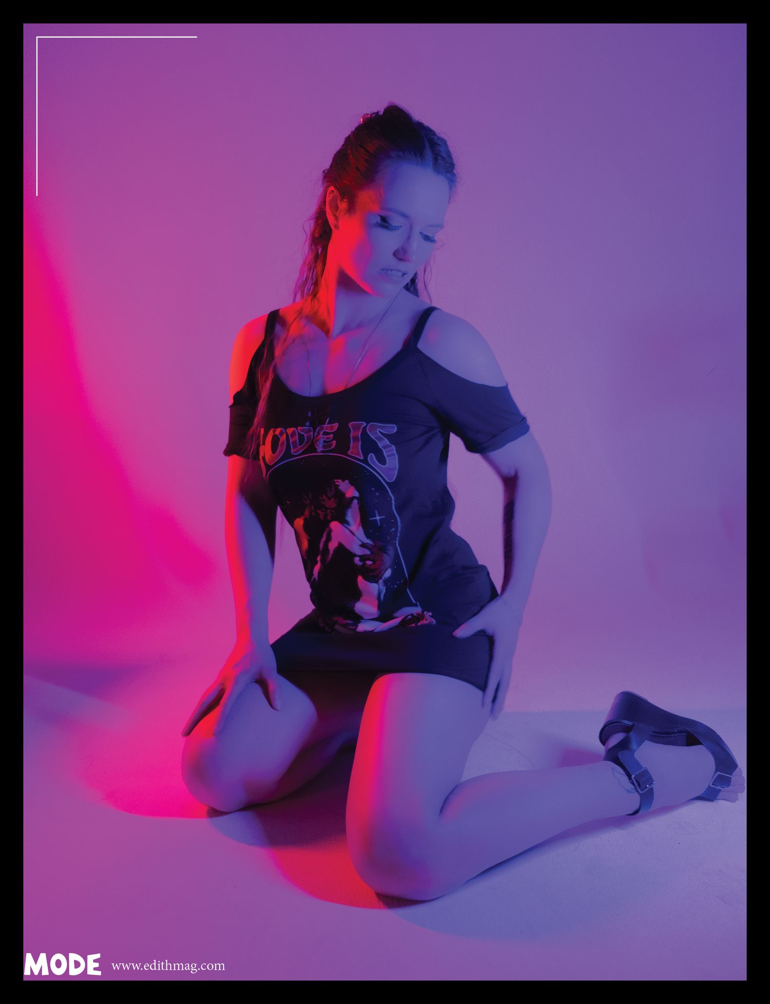 Modern fashion portrait with vibrant pink and purple gradient lighting.