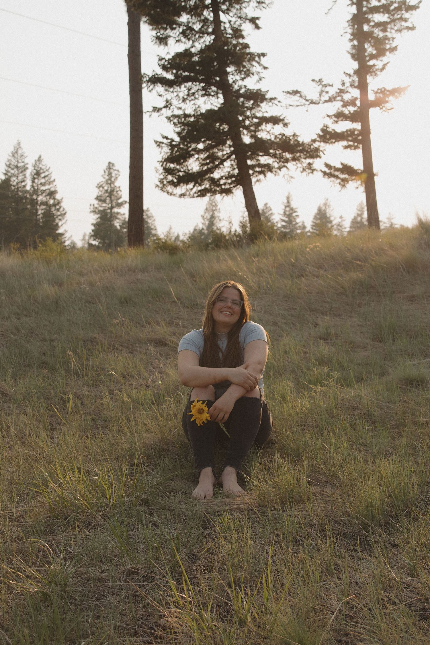 Montana Photographer sitting in a field