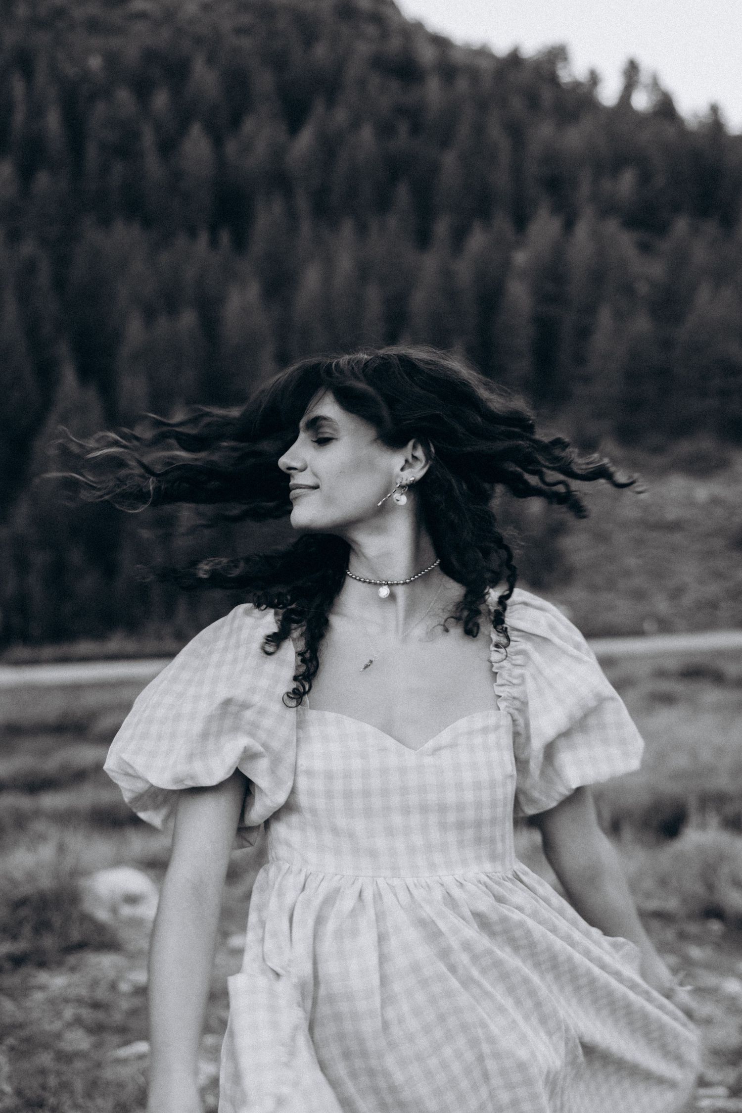 A wild and free portrait of a women in black and white.