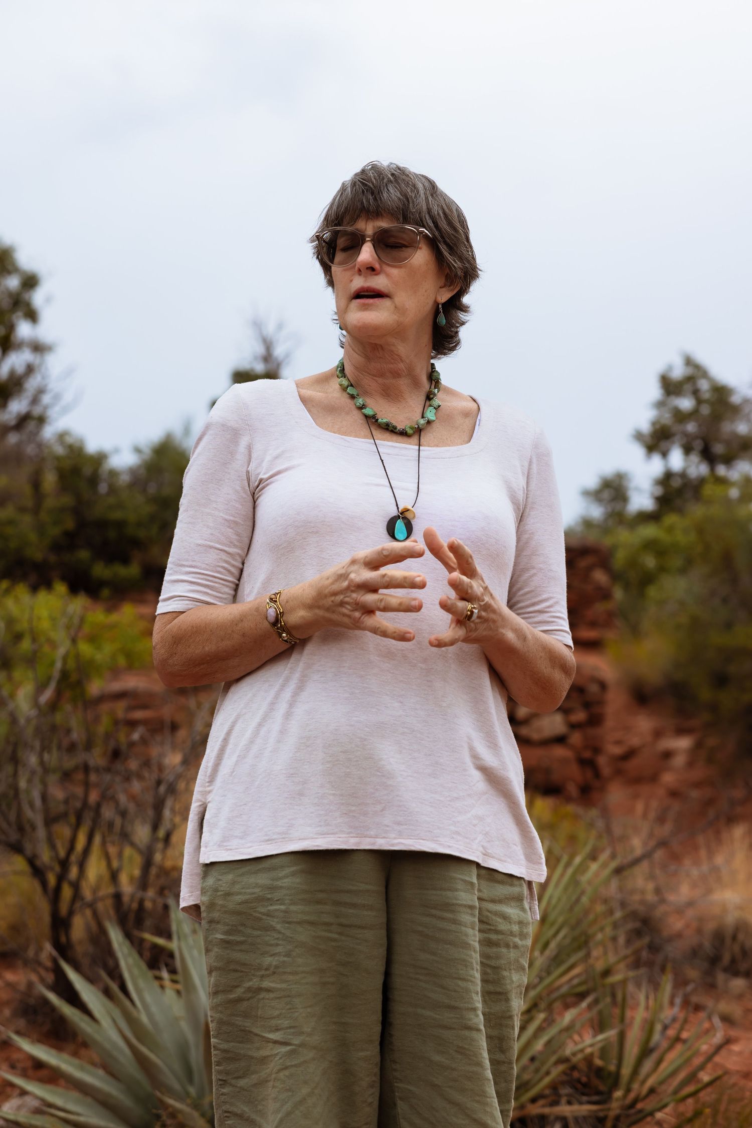 Women of non-profit organization leads ceremony at the desert.
