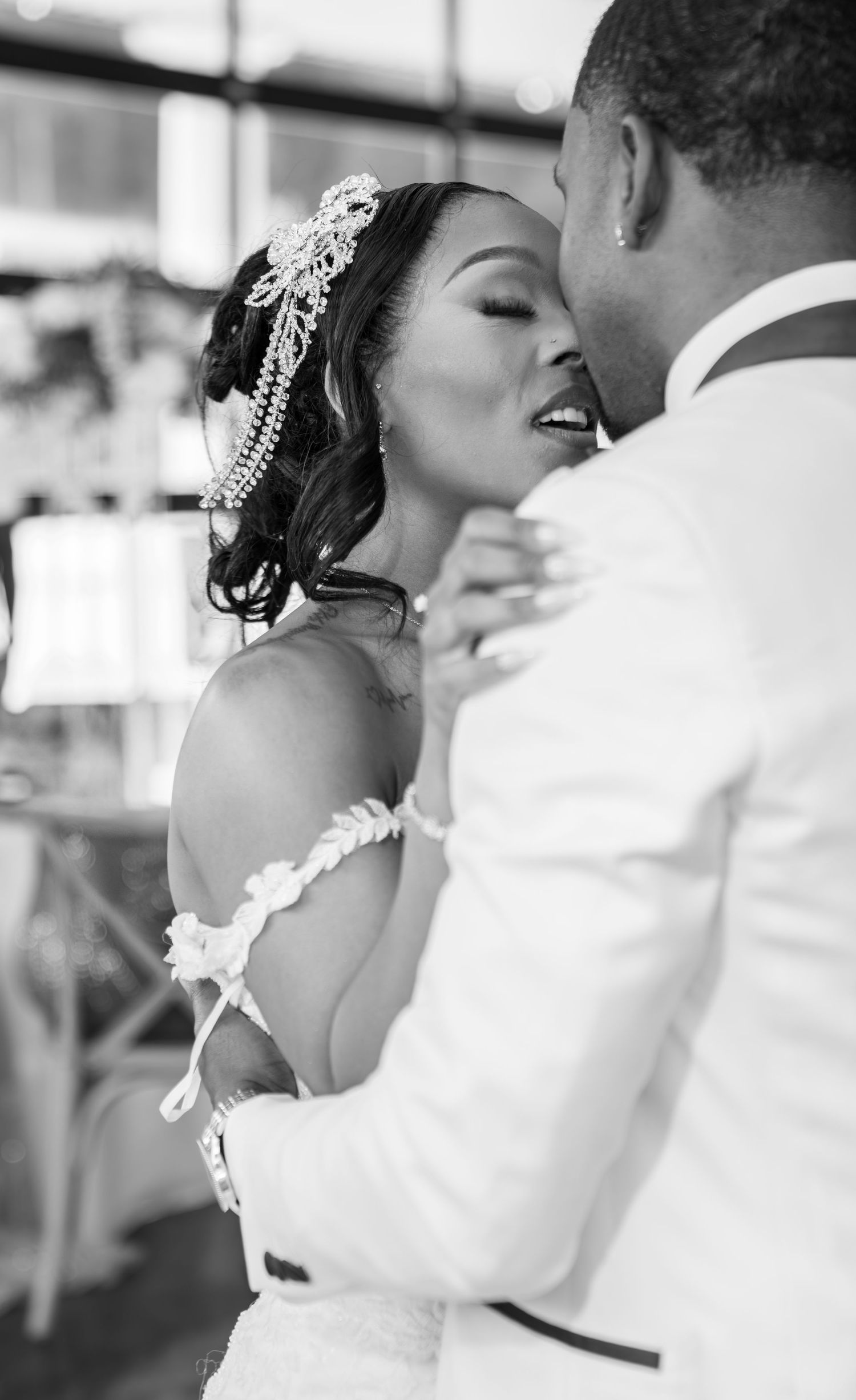 Black and white photo series showing romantic wedding dance moments with the couple in elegant attire.