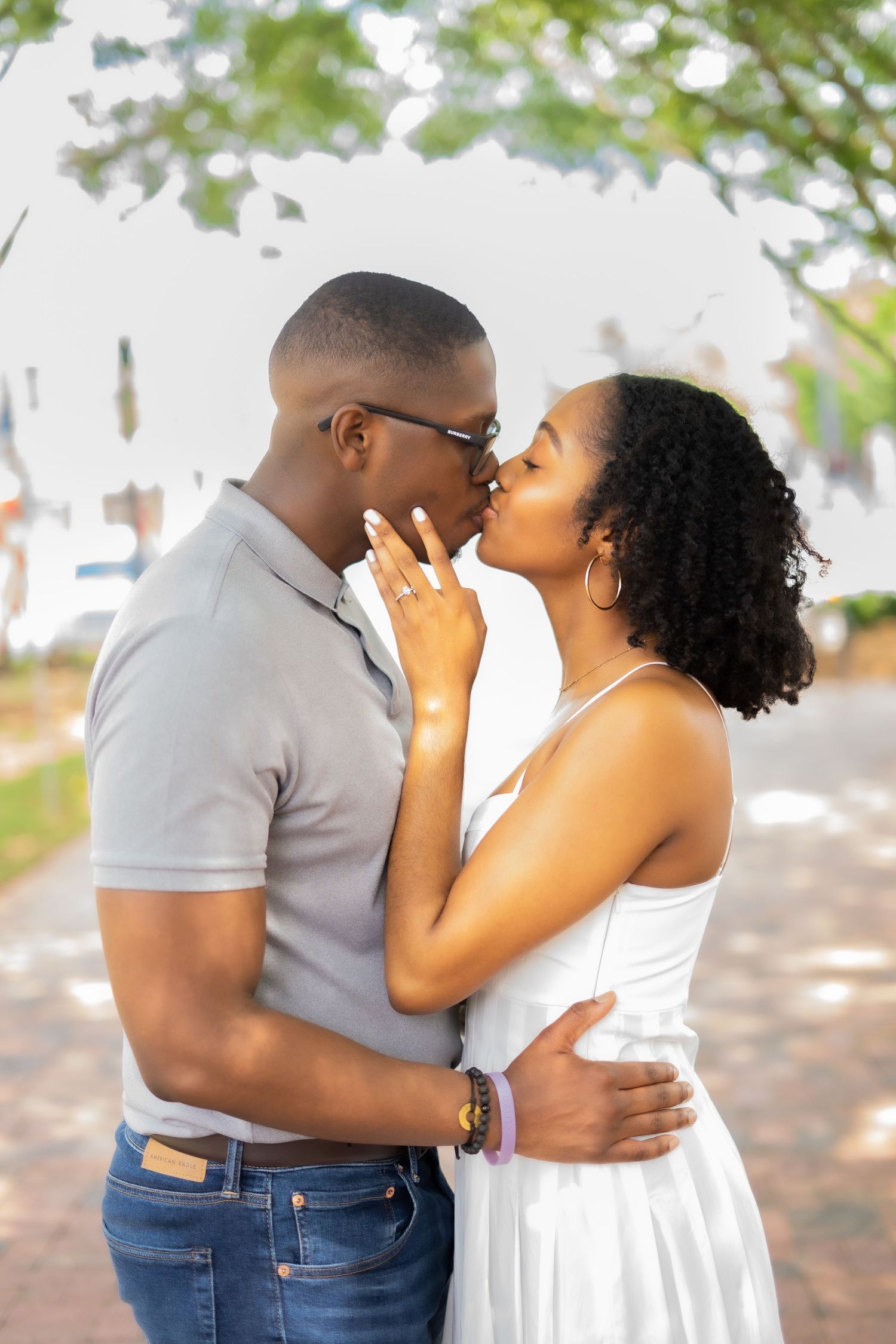 An engaged couple sharing an intimate moment outdoors during their photoshoot.