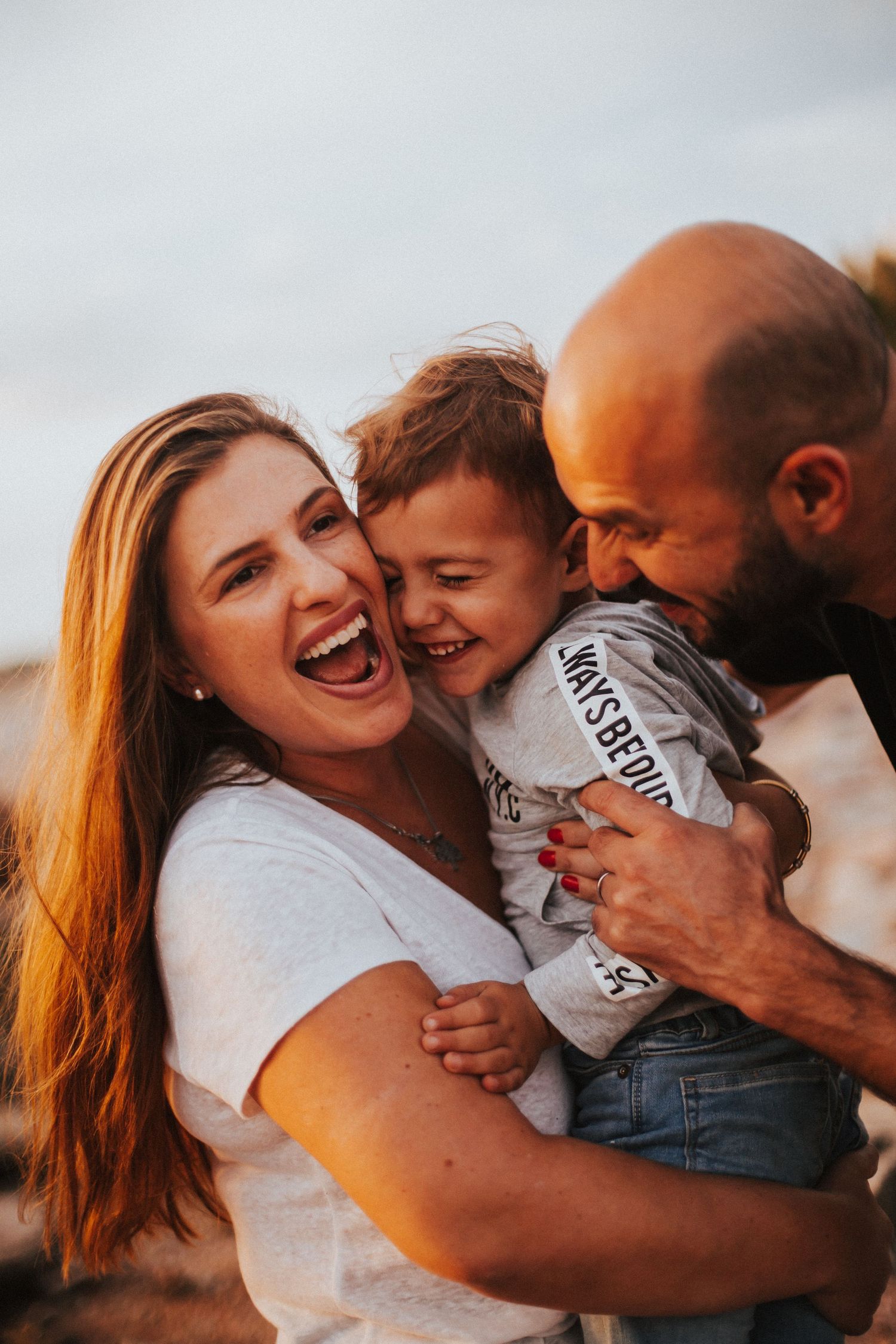 Joyful family moment captured during sunset.