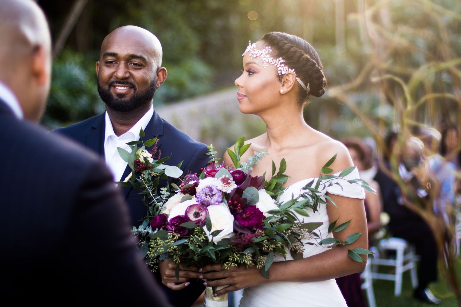 Bride and groom exchanging vows during a wedding ceremony at Fairchild Botanical Gardens in Miami, Florida.