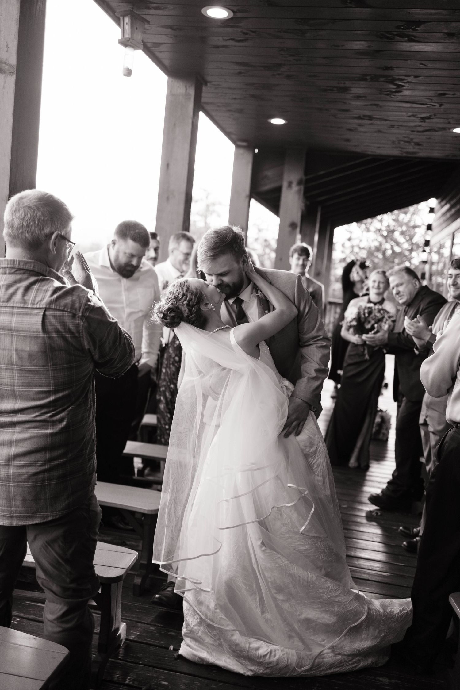 Wedding reception dance captured in dramatic black and white photography sequence.