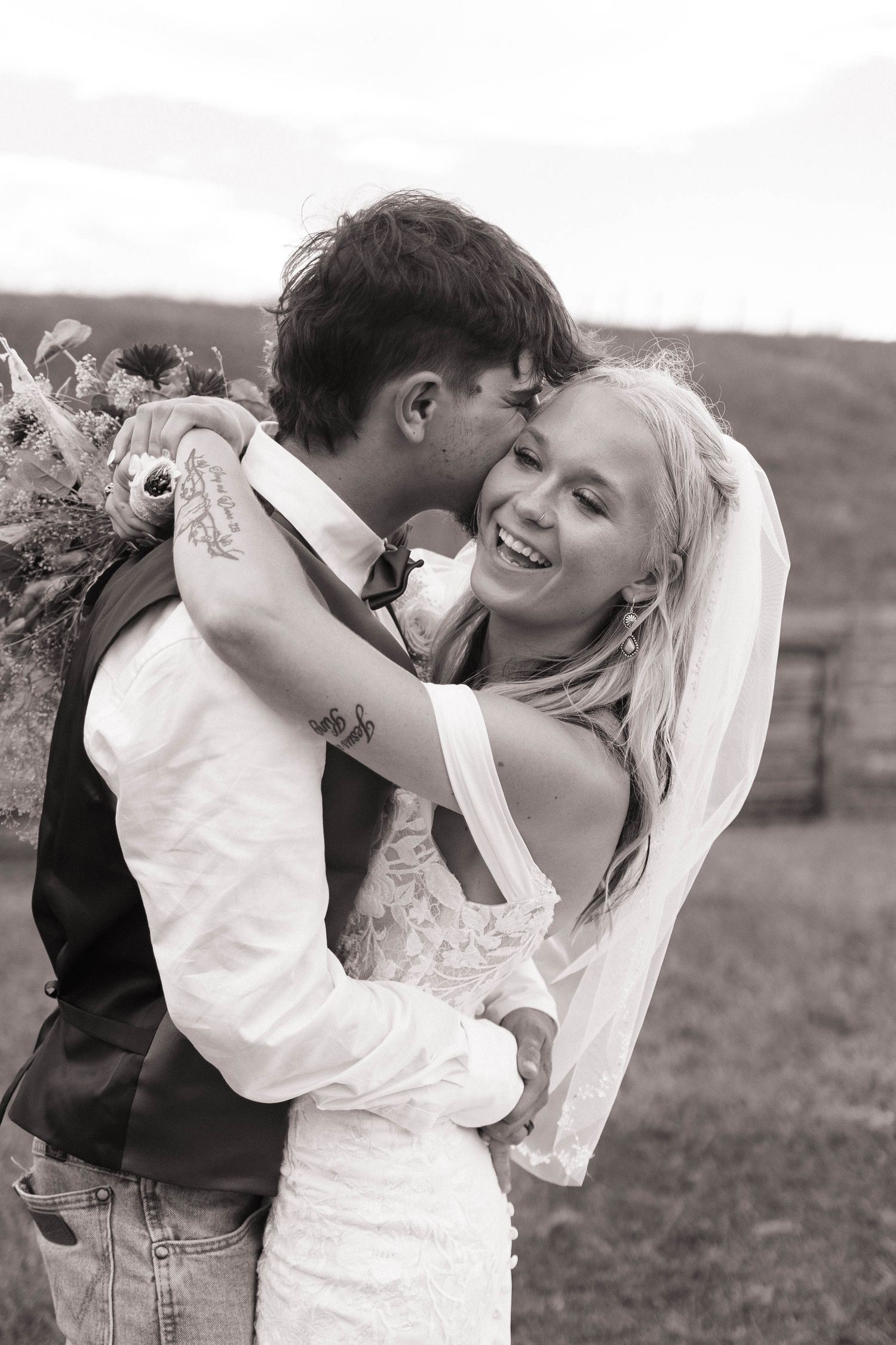 Romantic black and white wedding portraits showing tender moments between newlyweds.