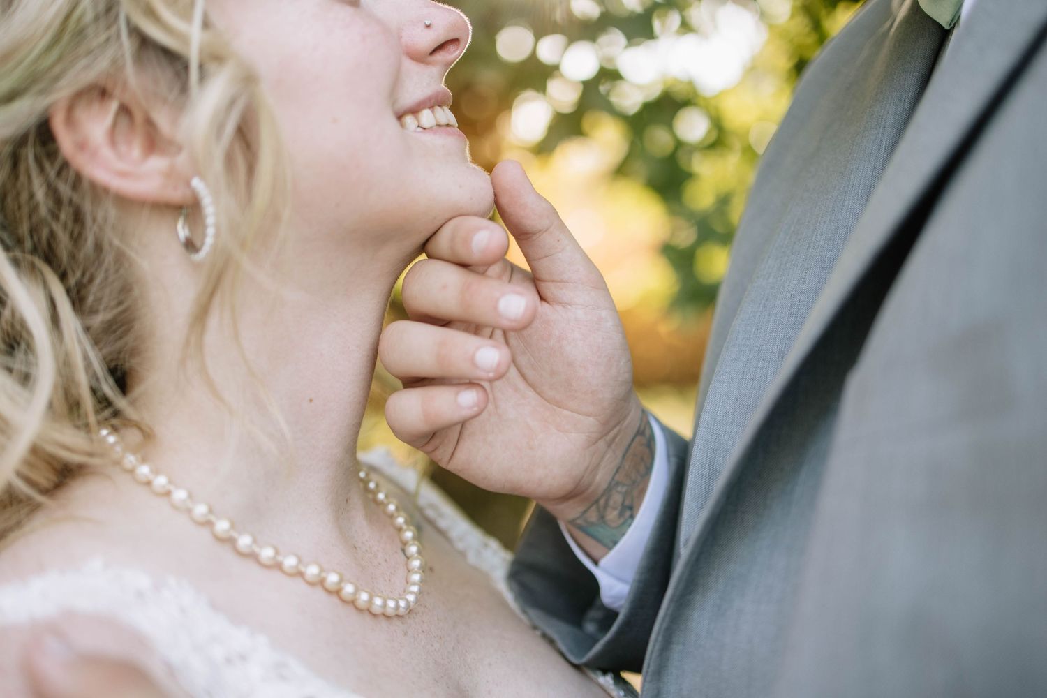 Close-up wedding portrait showing tender moment between couple.