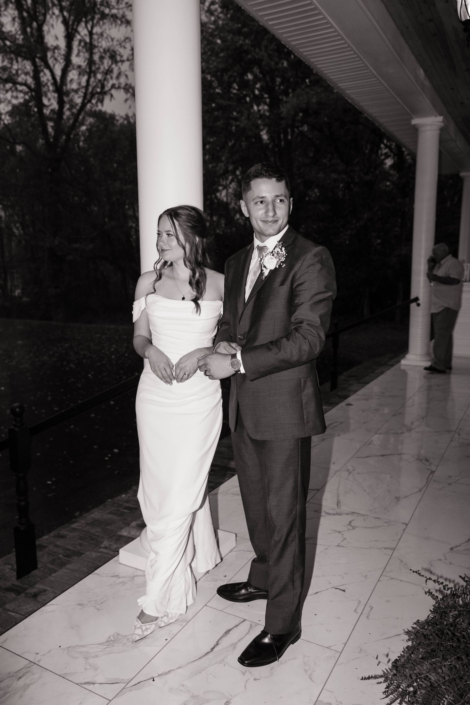 A sequence of black and white photos showing a couple dancing on a porch with white columns.