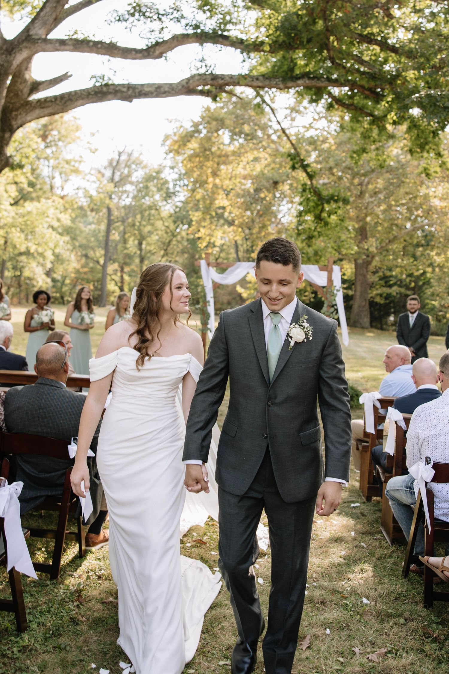 A sequence of wedding photos showing a couple walking and dancing together in an outdoor garden setting.