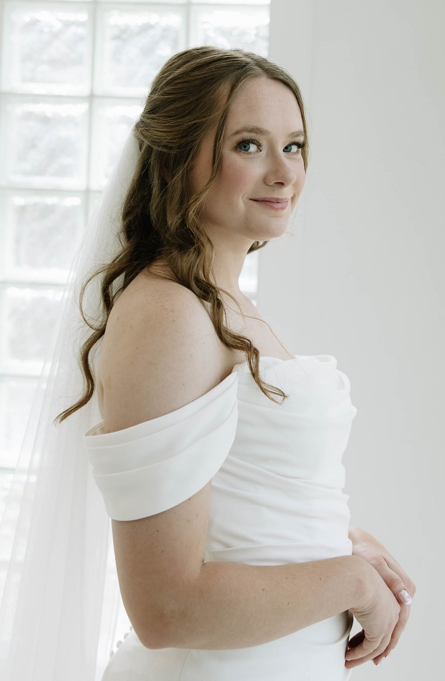 A series of soft and ethereal bridal portraits in white against a light background.