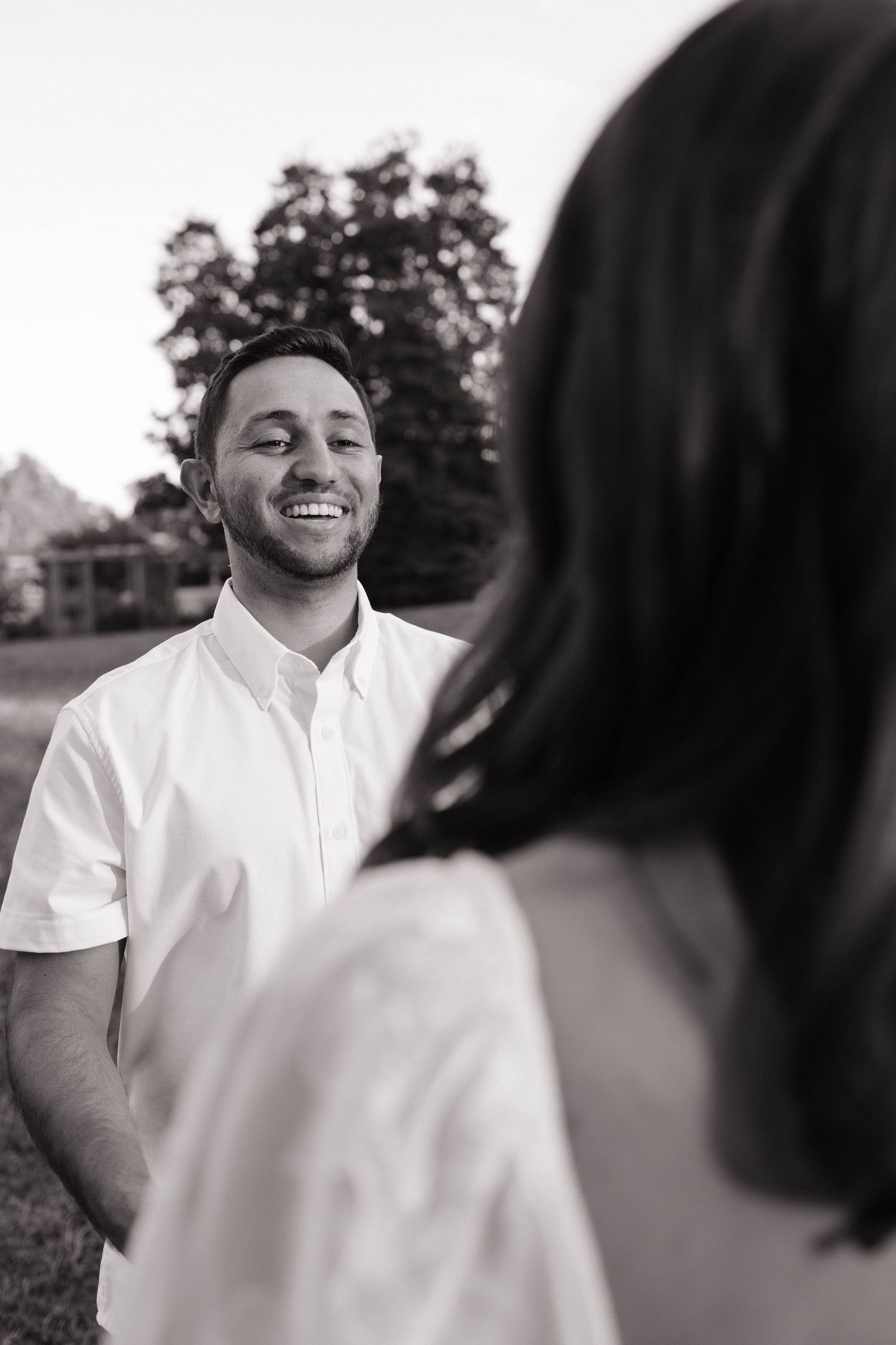 Candid outdoor portrait session capturing joyful expressions in natural light.