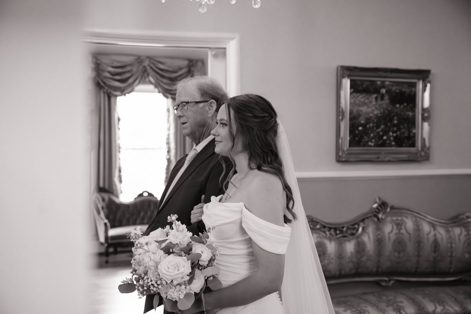 Wedding preparations with elegant decor and floral arrangements in a traditional indoor setting.