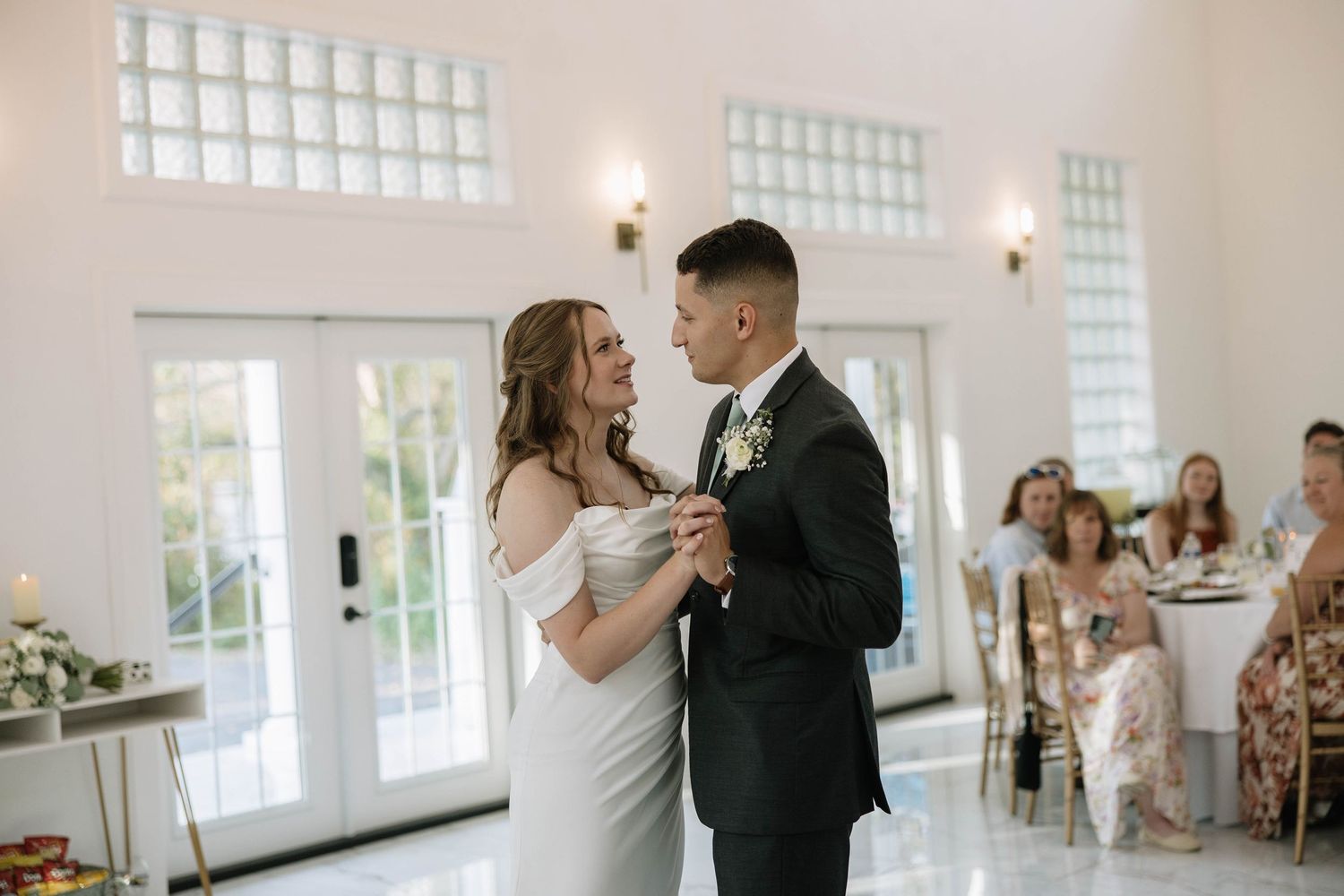 Wedding celebration sequence showing joyful moments inside bright reception venue.