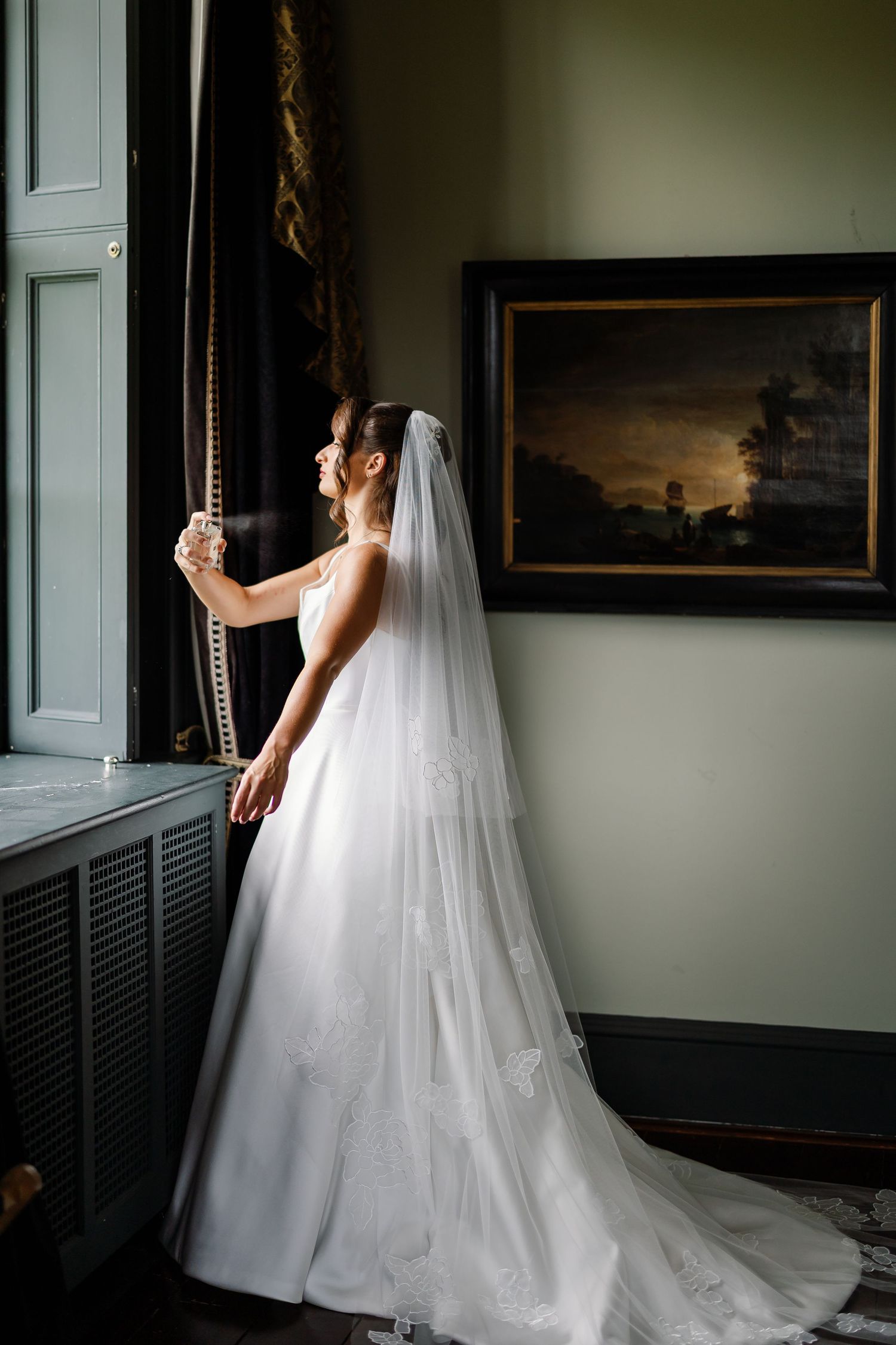 “Bride and groom standing in front of Kinmount House, a stately Scottish mansion with sweeping lawns and classic architecture.”