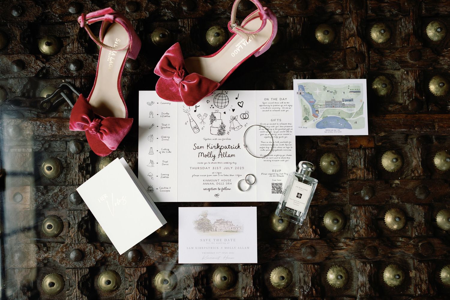 Vintage style letters and envelopes arranged on dark wooden surface with scattered gold ornaments.
