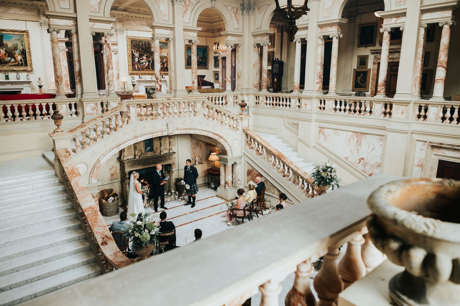 Elegant white marble staircase in a grand museum interior with ornate architecture and architectural details.