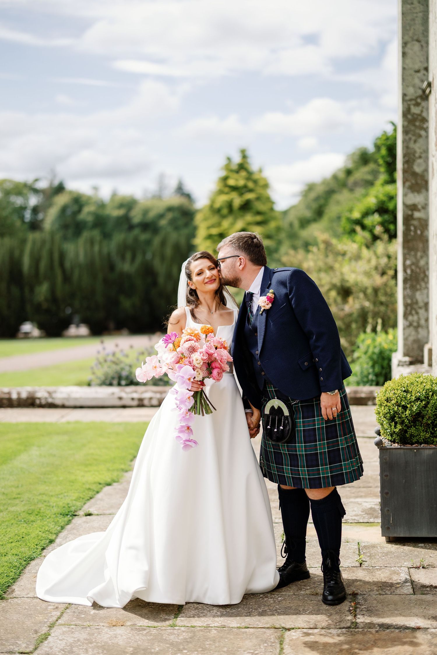 “Elegant wedding venue at Kinmount House in Scotland, featuring a grand historic mansion surrounded by lush countryside.”