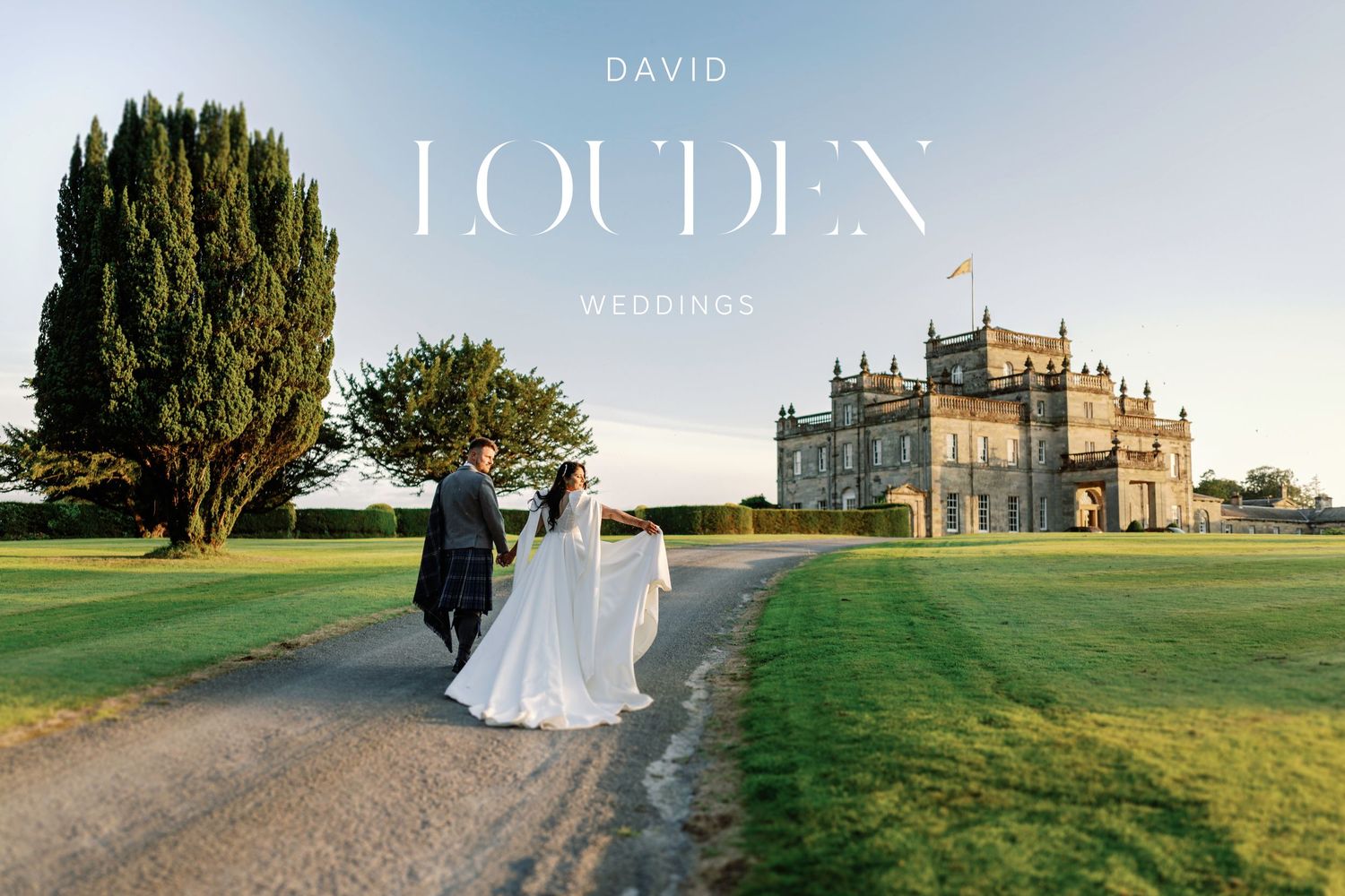 Ethereal wedding scene with couple walking path towards grand historic castle estate at sunset. Kinmount House wedding pictures
