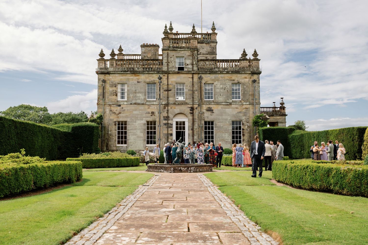 “Elegant wedding venue at Kinmount House in Scotland, featuring a grand historic mansion surrounded by lush countryside.”