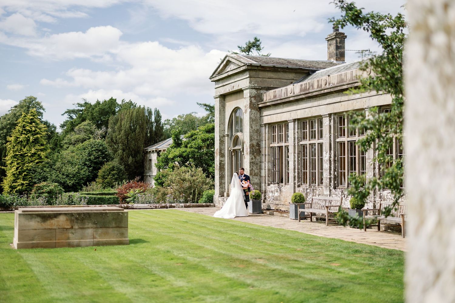“Elegant wedding venue at Kinmount House in Scotland, featuring a grand historic mansion surrounded by lush countryside.”