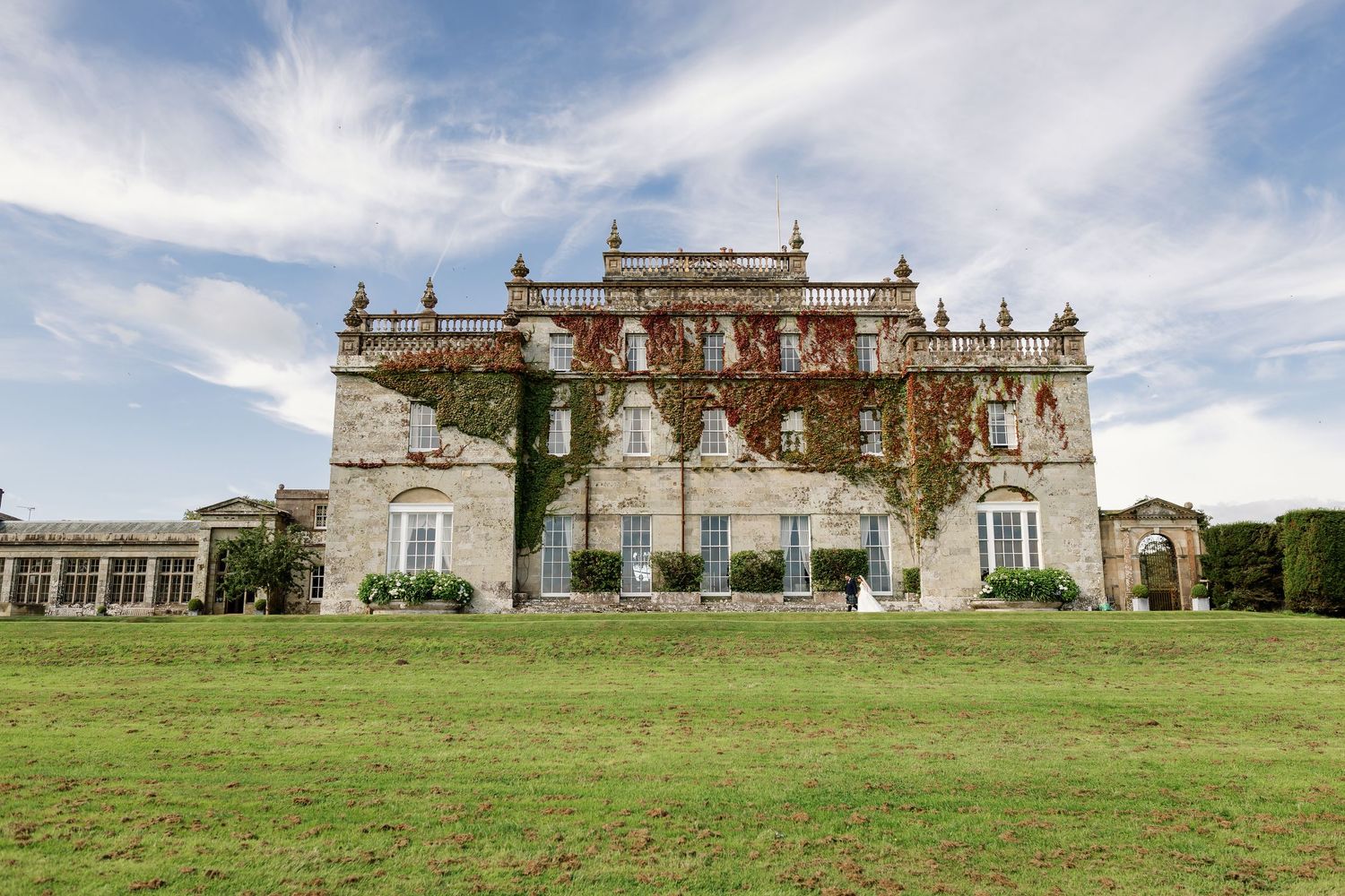 “Elegant wedding venue at Kinmount House in Scotland, featuring a grand historic mansion surrounded by lush countryside.”