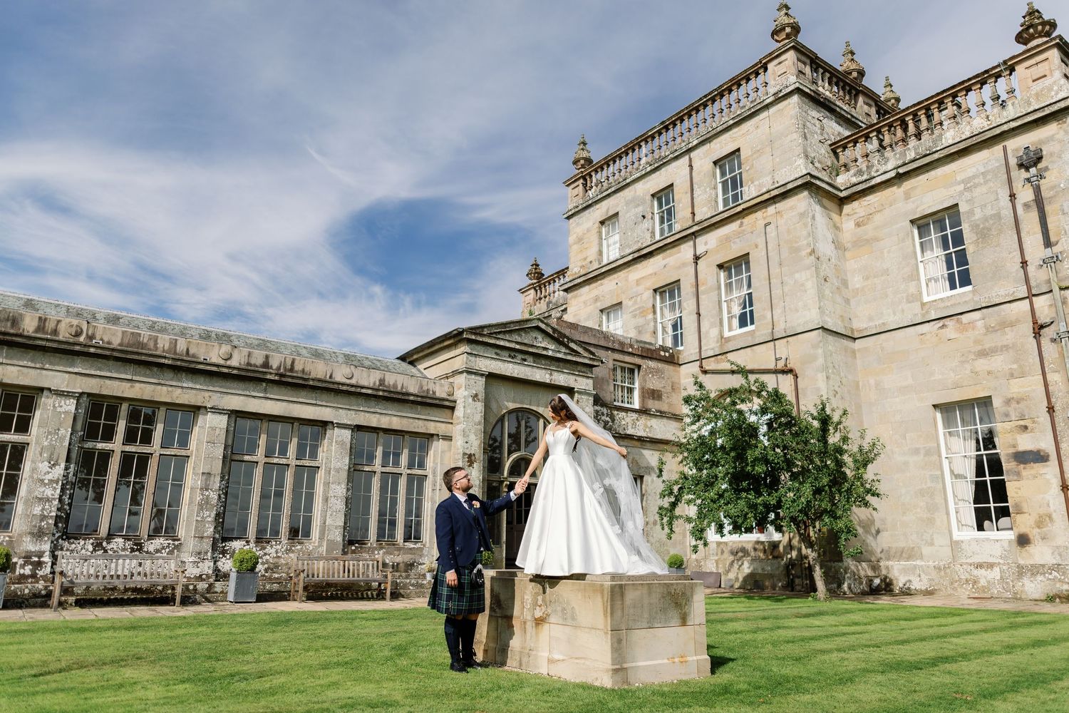 “Elegant wedding venue at Kinmount House in Scotland, featuring a grand historic mansion surrounded by lush countryside.”