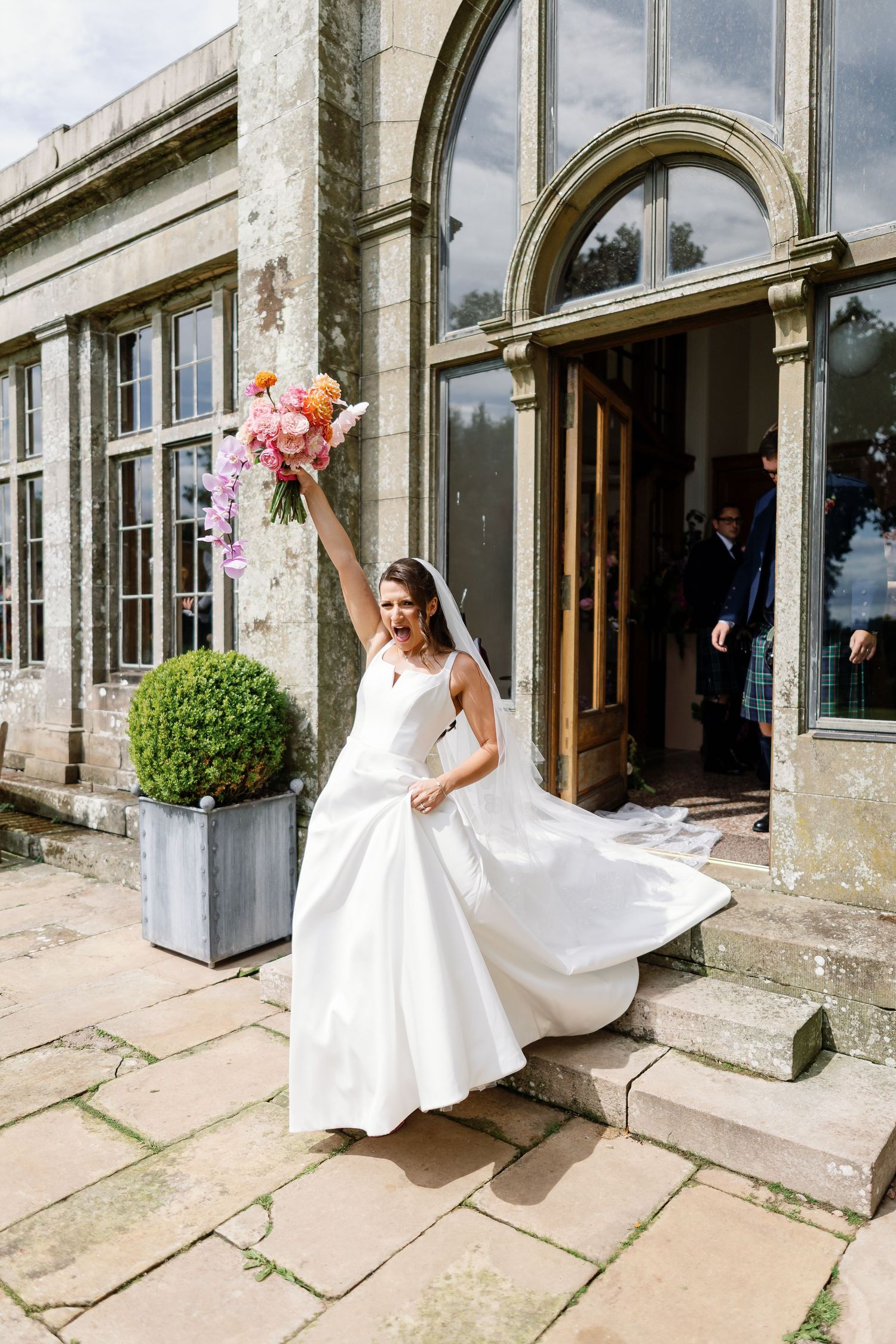 “Elegant wedding venue at Kinmount House in Scotland, featuring a grand historic mansion surrounded by lush countryside.”