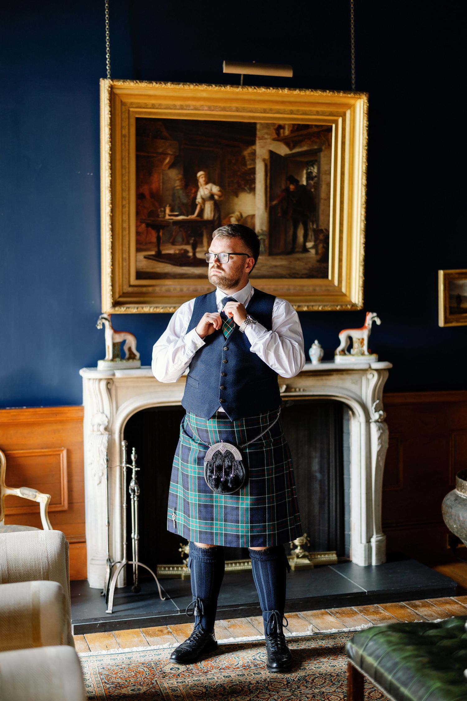 A series of photos showing someone in a traditional Scottish kilt sitting thoughtfully by a fireplace.