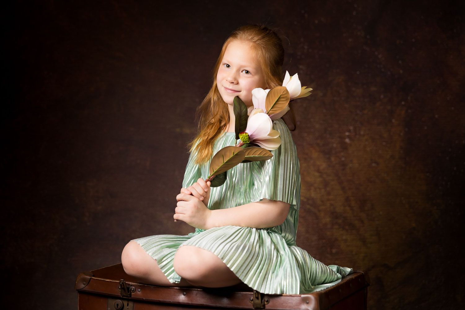 Girl with flowers in the studio shoot