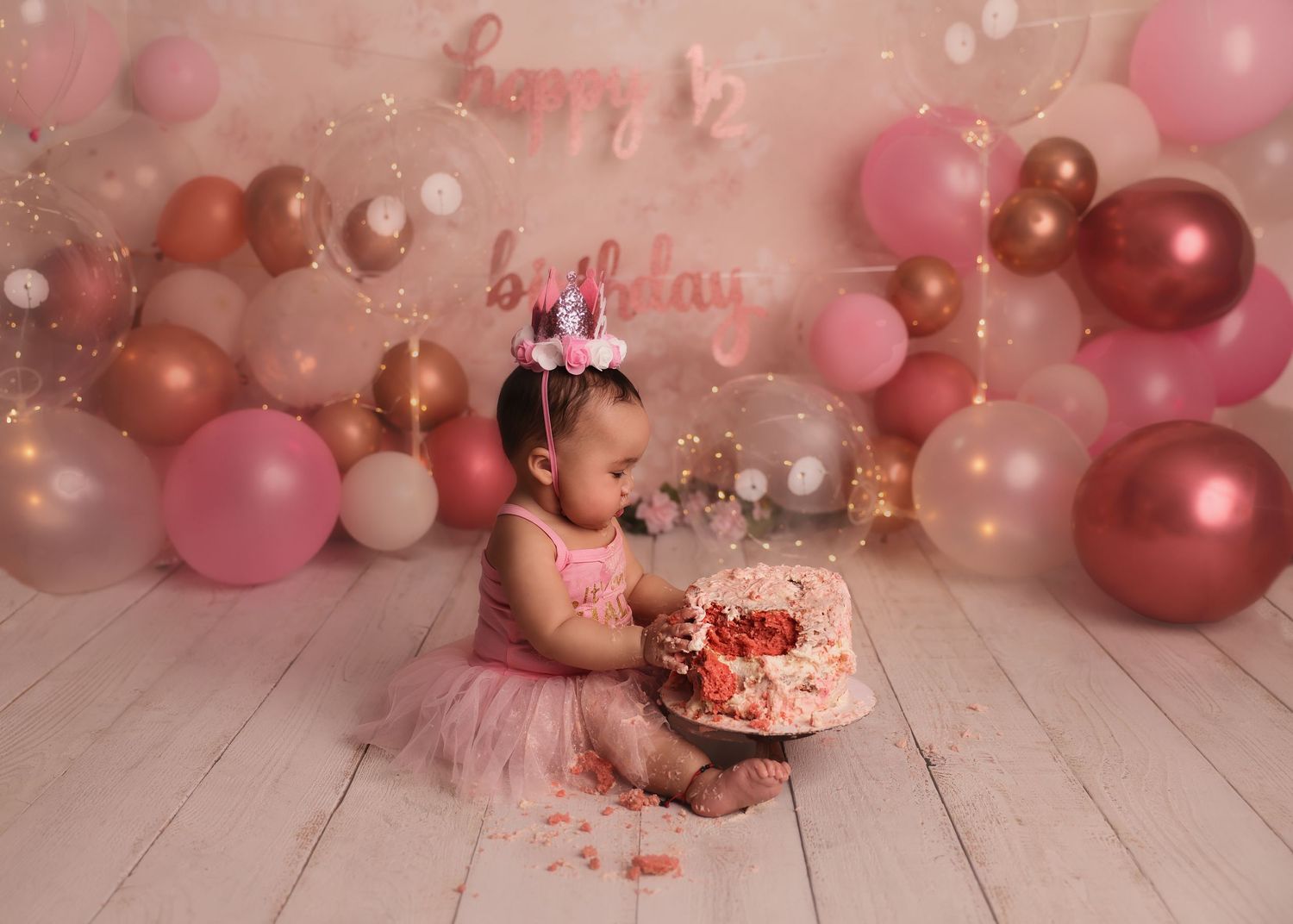 one year old baby with cake for cake smash photoshoot