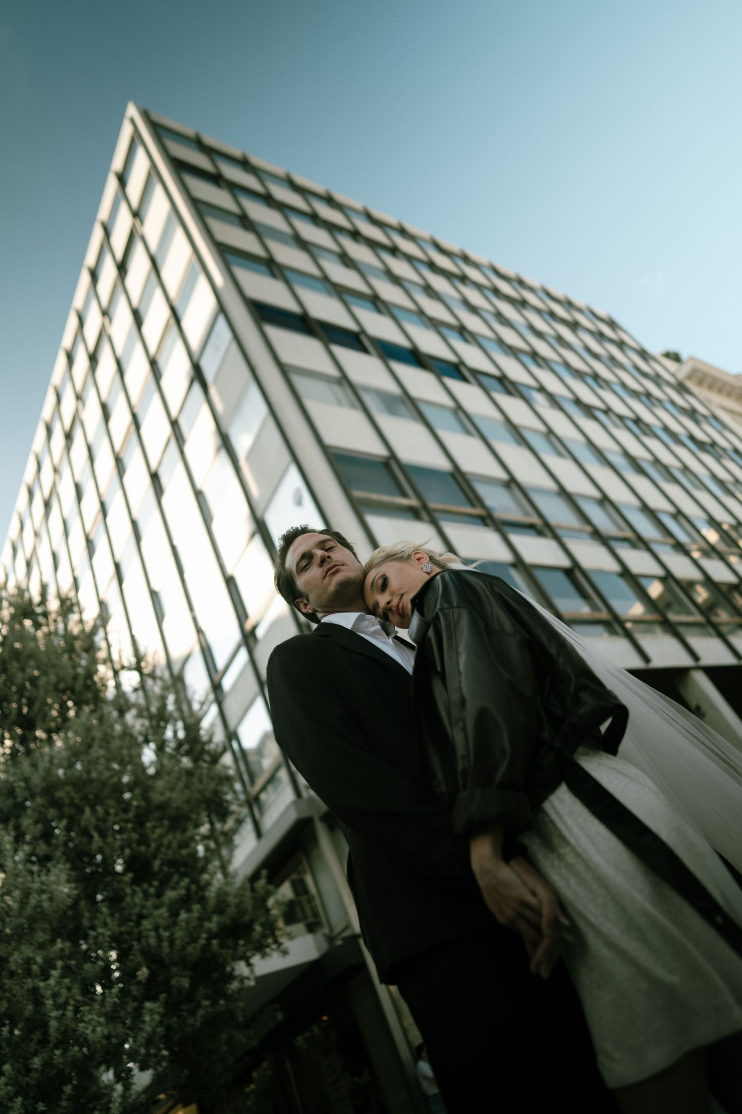 Dramatic low-angle architectural shots of a modern building with diagonal patterns.