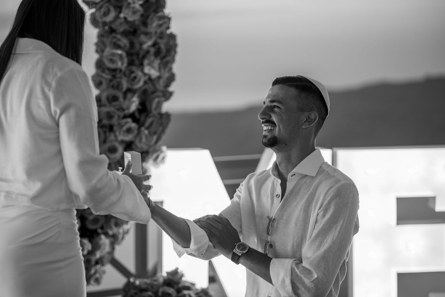 Black and white proposal sequence showing intimate moments between couple.