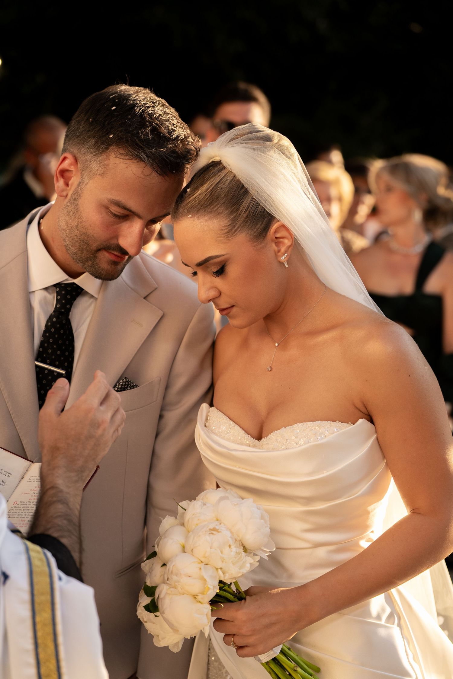 A romantic wedding moment captured in a series of intimate close-up shots showing tender interactions between the couple.