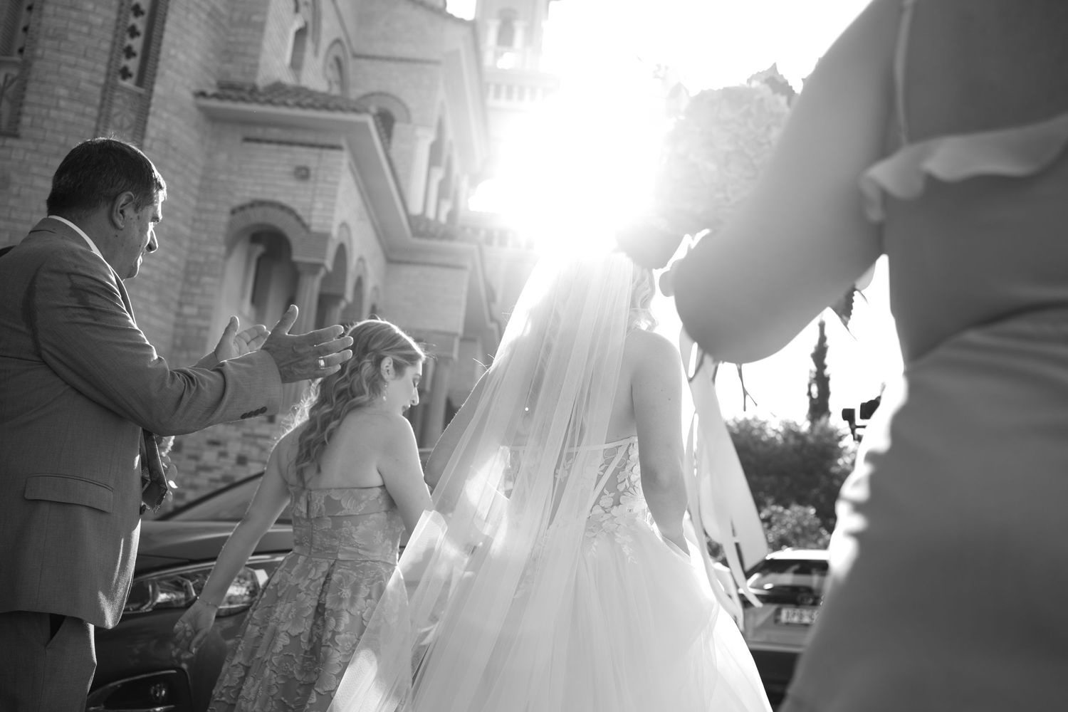 A black and white photo montage of wedding moments showing dancing, embraces and candid celebrations at a reception.