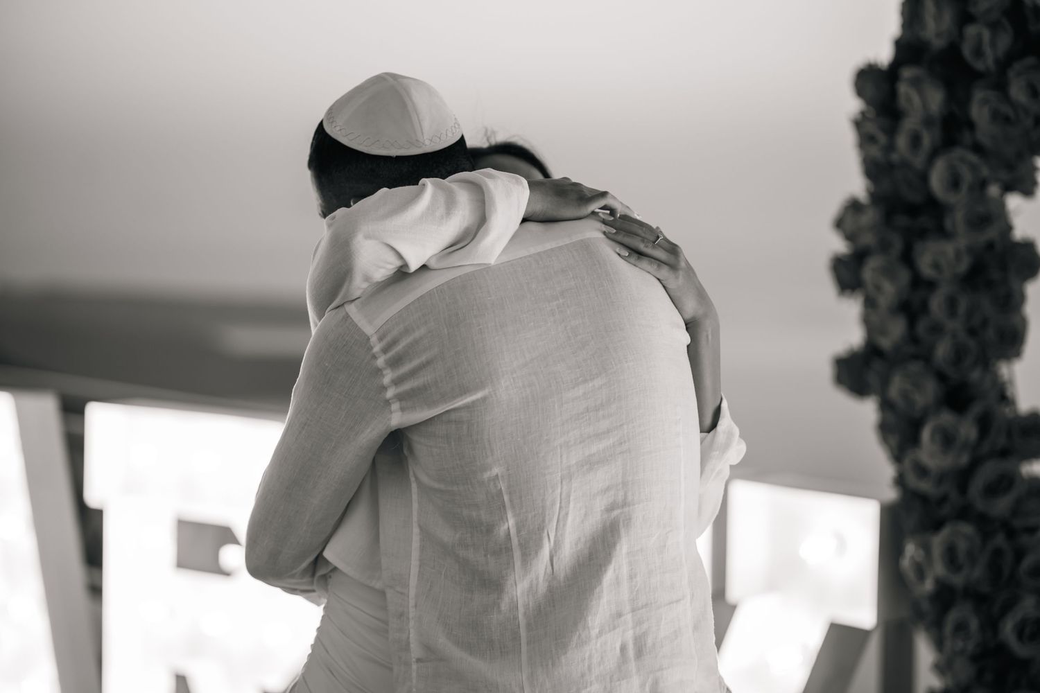 Intimate proposal moments captured in black and white with emotional reactions.